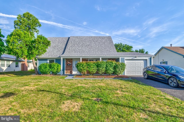 ranch-style home with a front yard and a garage