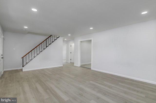 unfurnished living room with light hardwood / wood-style flooring