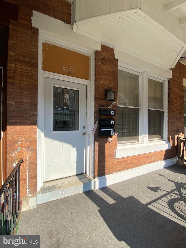 doorway to property featuring covered porch