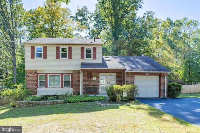 view of front of property with a garage and a front lawn