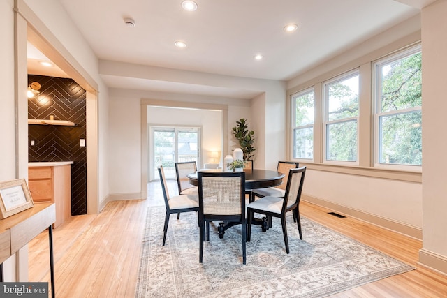 dining area featuring wood-type flooring