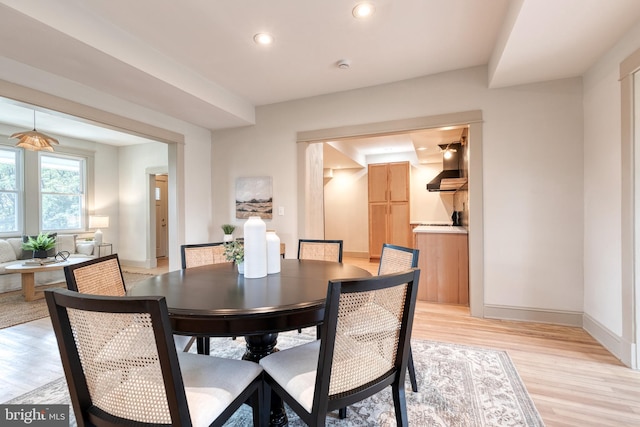 dining space with light wood-type flooring