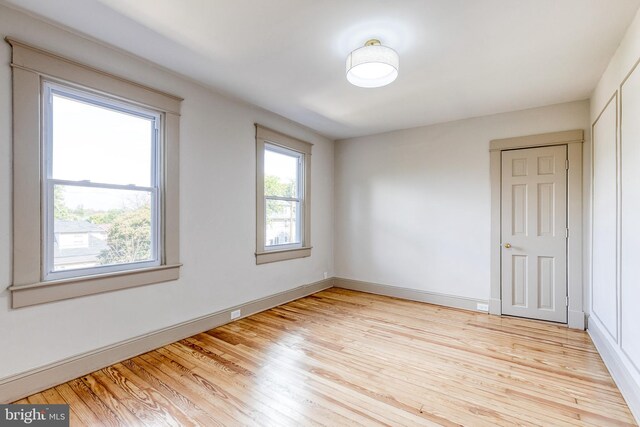 spare room featuring light wood-type flooring