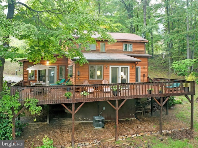 rear view of house featuring a deck and central AC unit