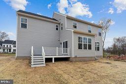 back of property featuring a deck