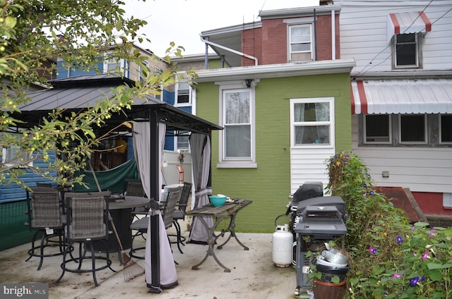 back of house with a patio