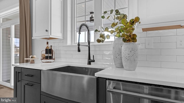 kitchen with white cabinetry, gray cabinets, sink, light hardwood / wood-style flooring, and stainless steel dishwasher