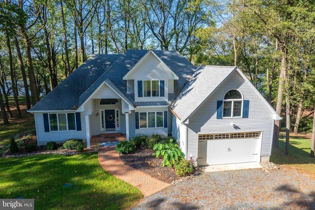 view of front facade featuring a front yard and a garage