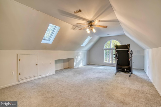 bonus room featuring lofted ceiling, light colored carpet, and ceiling fan