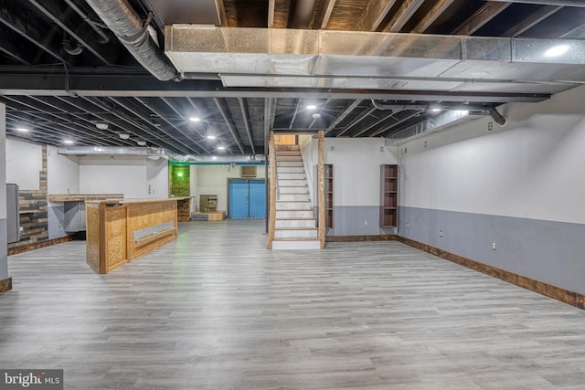 basement featuring hardwood / wood-style floors