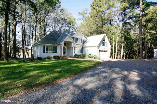 view of front facade with a front lawn and a garage