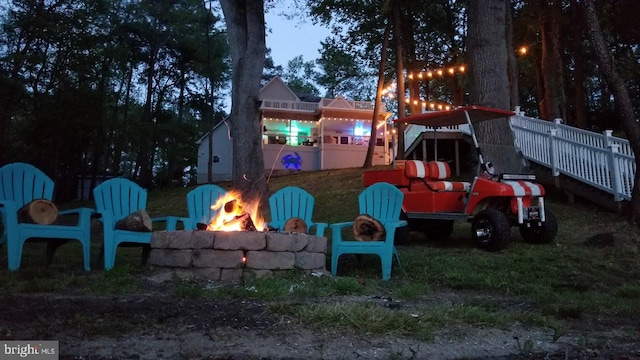 view of yard featuring an outdoor fire pit