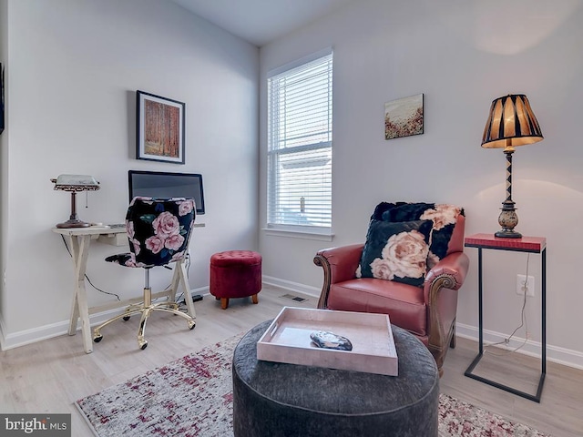 sitting room featuring hardwood / wood-style floors