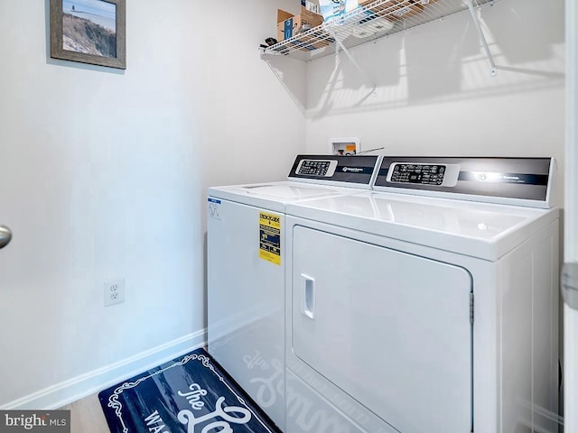 washroom featuring washing machine and dryer