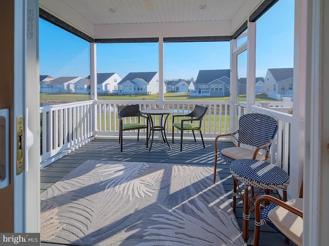 sunroom / solarium featuring wooden ceiling