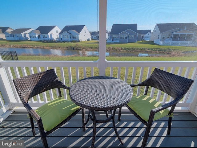 balcony featuring a water view