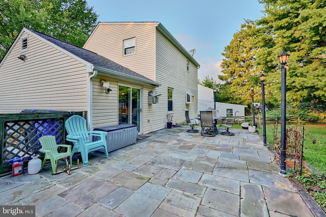 rear view of house featuring a patio area