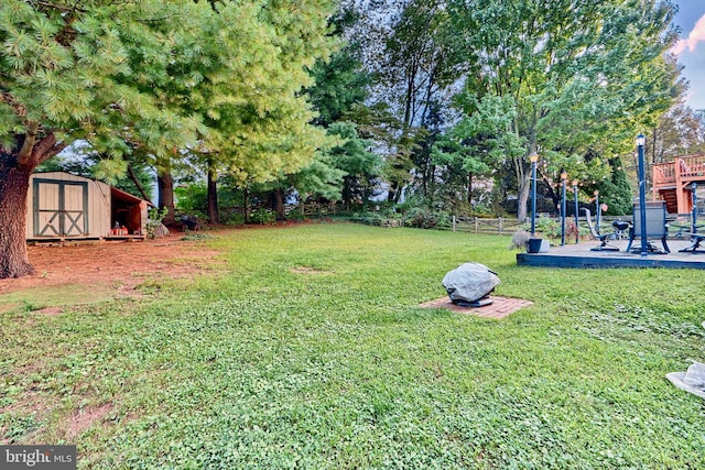 view of yard featuring a patio area and a storage unit