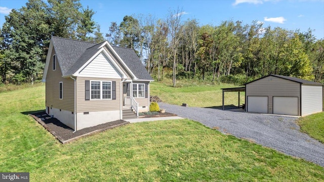 view of front of property featuring a garage, an outdoor structure, and a front lawn