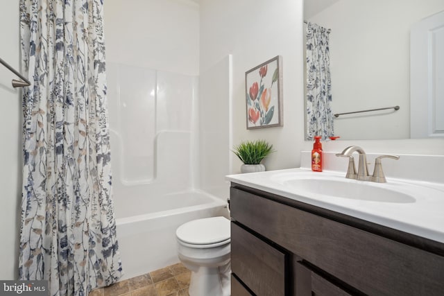 full bathroom with vanity, toilet, and shower / tub combo with curtain