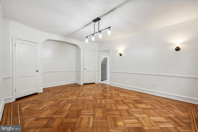 spare room with light parquet flooring