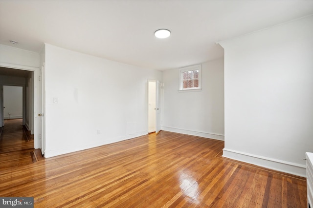 spare room with wood-type flooring