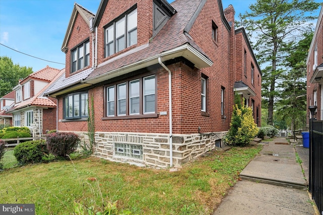 view of property exterior with a lawn