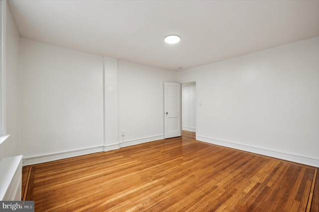 empty room with wood-type flooring