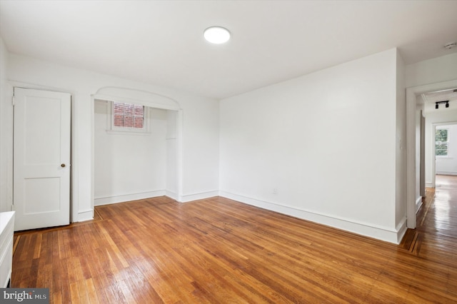 empty room featuring hardwood / wood-style flooring