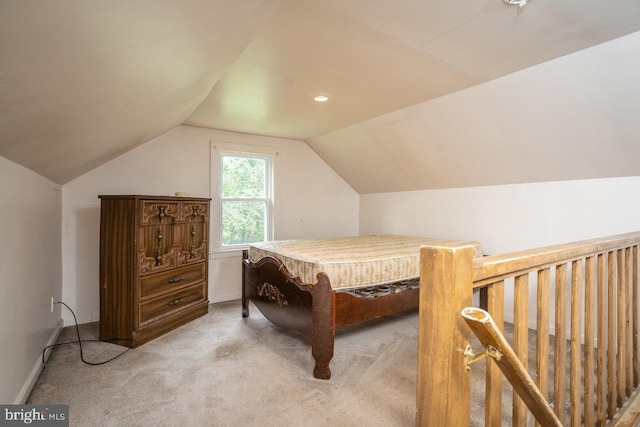 carpeted bedroom featuring lofted ceiling