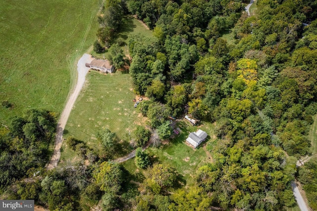 drone / aerial view with a view of trees