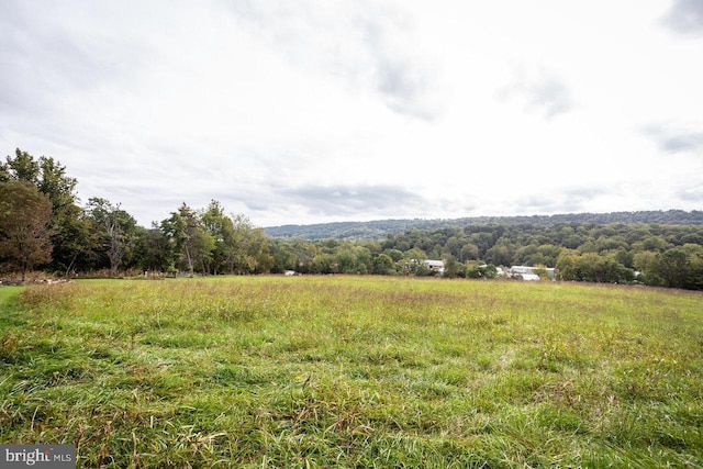 mountain view featuring a rural view