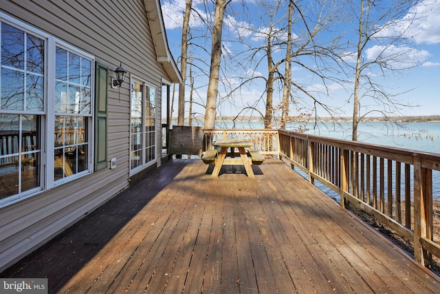 deck featuring a water view