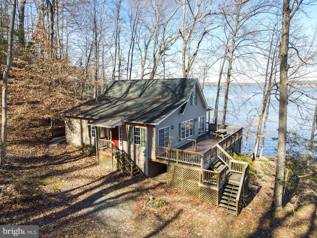 view of front of property with a deck with water view