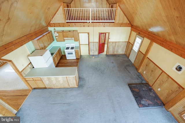 interior space featuring high vaulted ceiling, wood ceiling, and wood walls