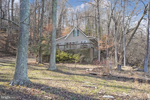 view of yard with a wooden deck