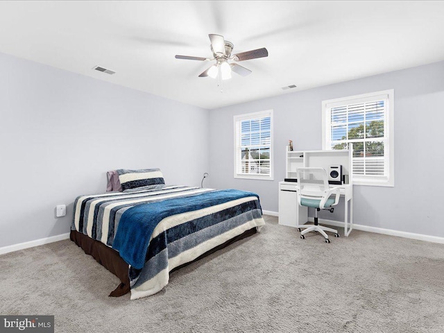 bedroom with ceiling fan and carpet