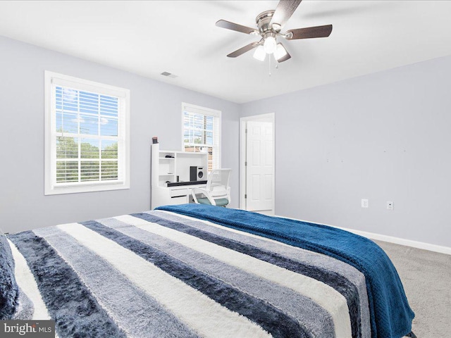 carpeted bedroom featuring ceiling fan