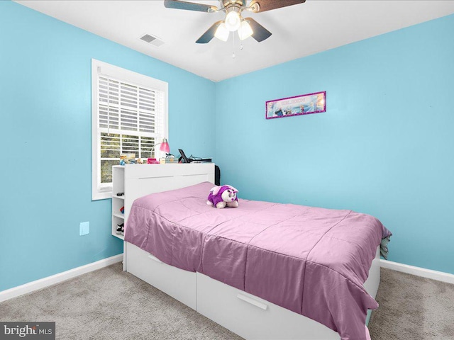 carpeted bedroom with ceiling fan