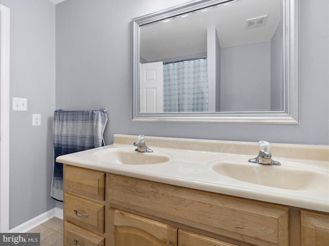 bathroom featuring tile patterned floors and vanity