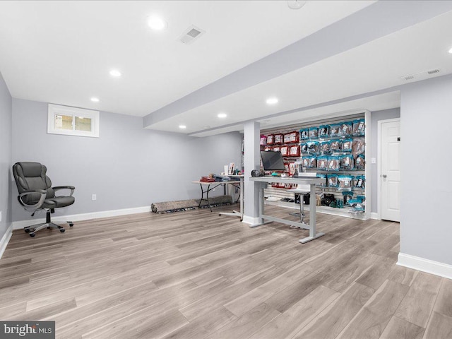 exercise area featuring light hardwood / wood-style flooring