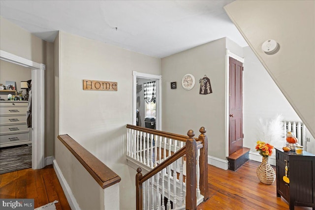 corridor featuring hardwood / wood-style floors