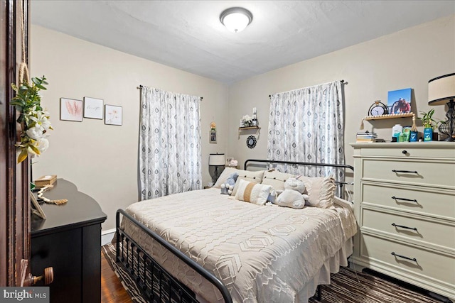 bedroom featuring dark hardwood / wood-style flooring