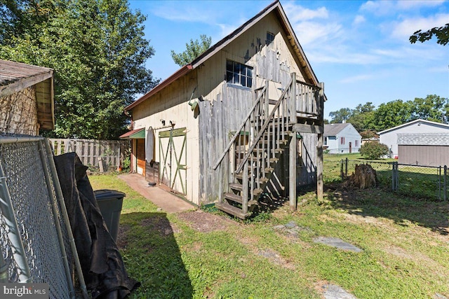 rear view of property with a yard