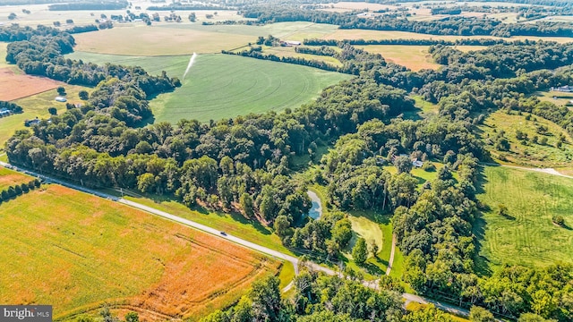 birds eye view of property featuring a rural view