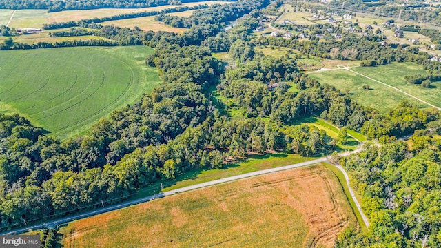 birds eye view of property with a rural view