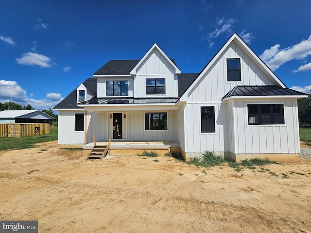 modern farmhouse style home with covered porch