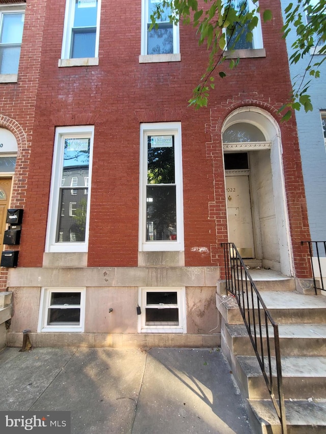 exterior space with brick siding