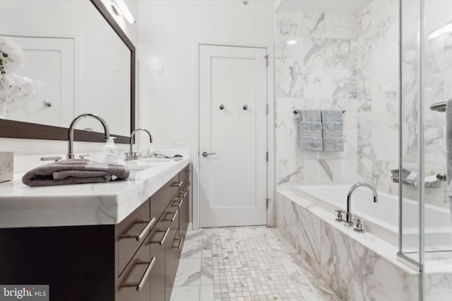 bathroom with tiled bath and vanity