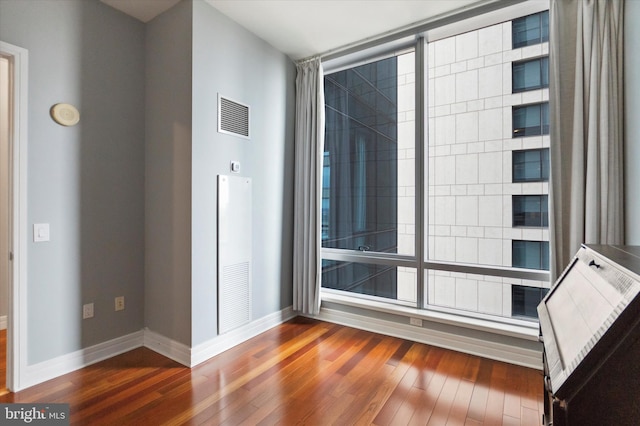 spare room featuring dark hardwood / wood-style flooring